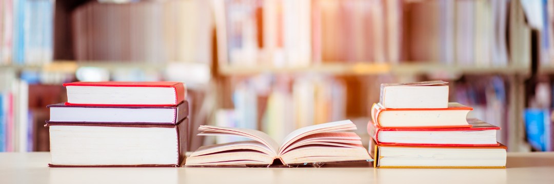 Library desk with books