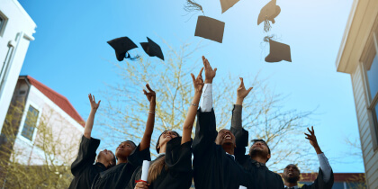 Students throwing their caps when graduating