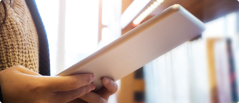 Librarian holding a tablet